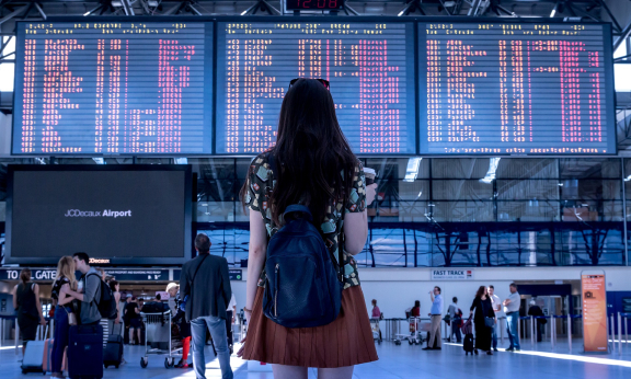 Person looking at flight display in airport