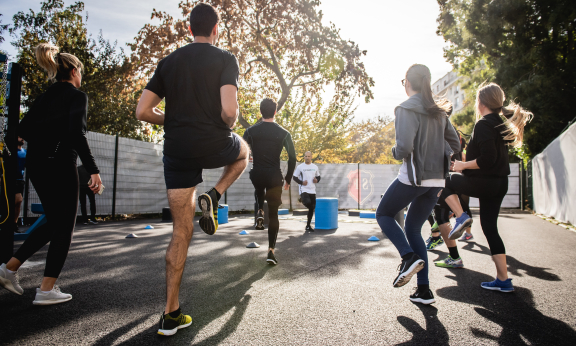 Group of people doing exercises outside