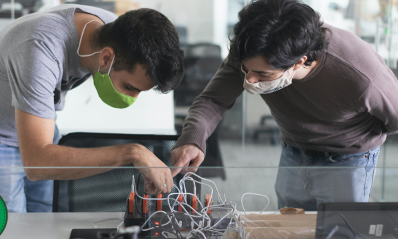 Two student researcher working in a lab