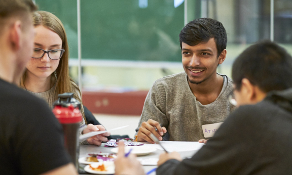 Four students working on a project