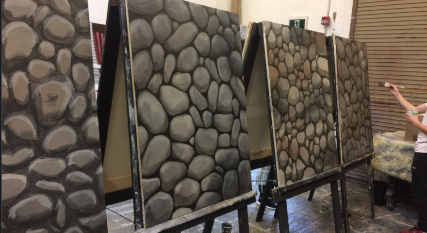 Paintings of rocks on large easels