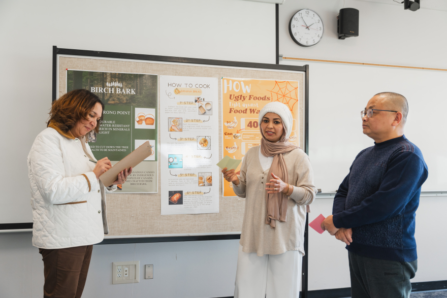 a student performing a demo to their teacher in a classroom