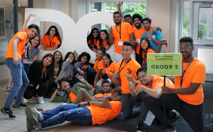 A group of new students and student staff at orientation