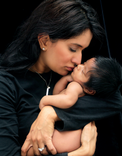 A woman holding her baby