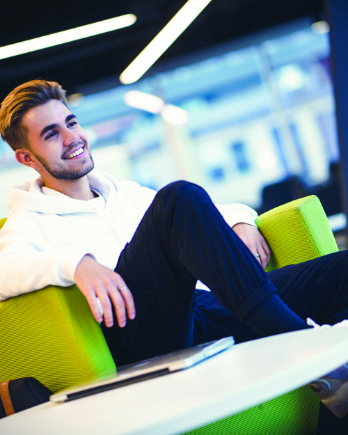 Boy sitting on a couch in Douglas