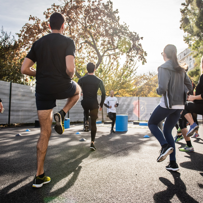 Group of people doing exercises outside