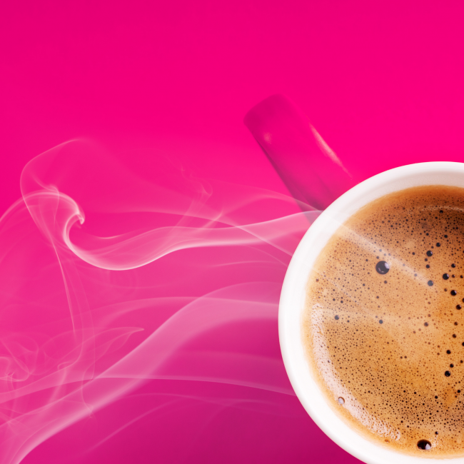 Pink coffee mug on pink background