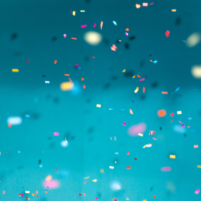 Falling confetti on a blue background