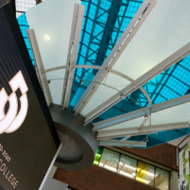New Westminster concourse ceiling with the Douglas College 50th anniversary logo