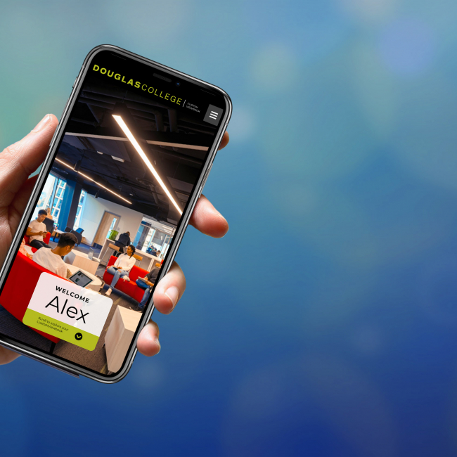 A hand is holding a mobile phone. On the phone there is a picture of students sitting on couches. The words Welcome Alex are written on the screen.