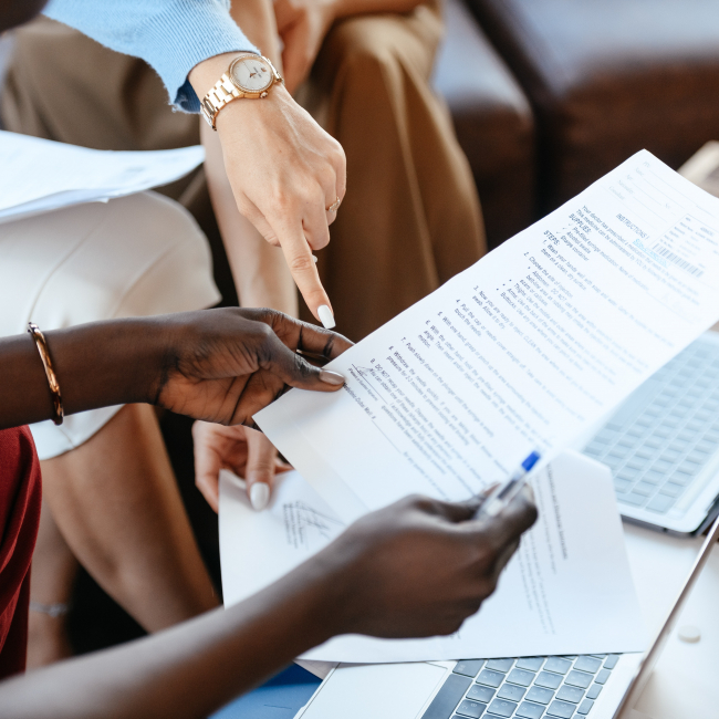 Researches holding reports and discussing the results