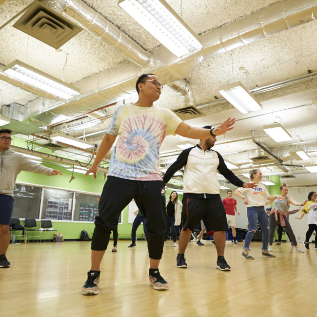 A group of students dancing in a dance studio
