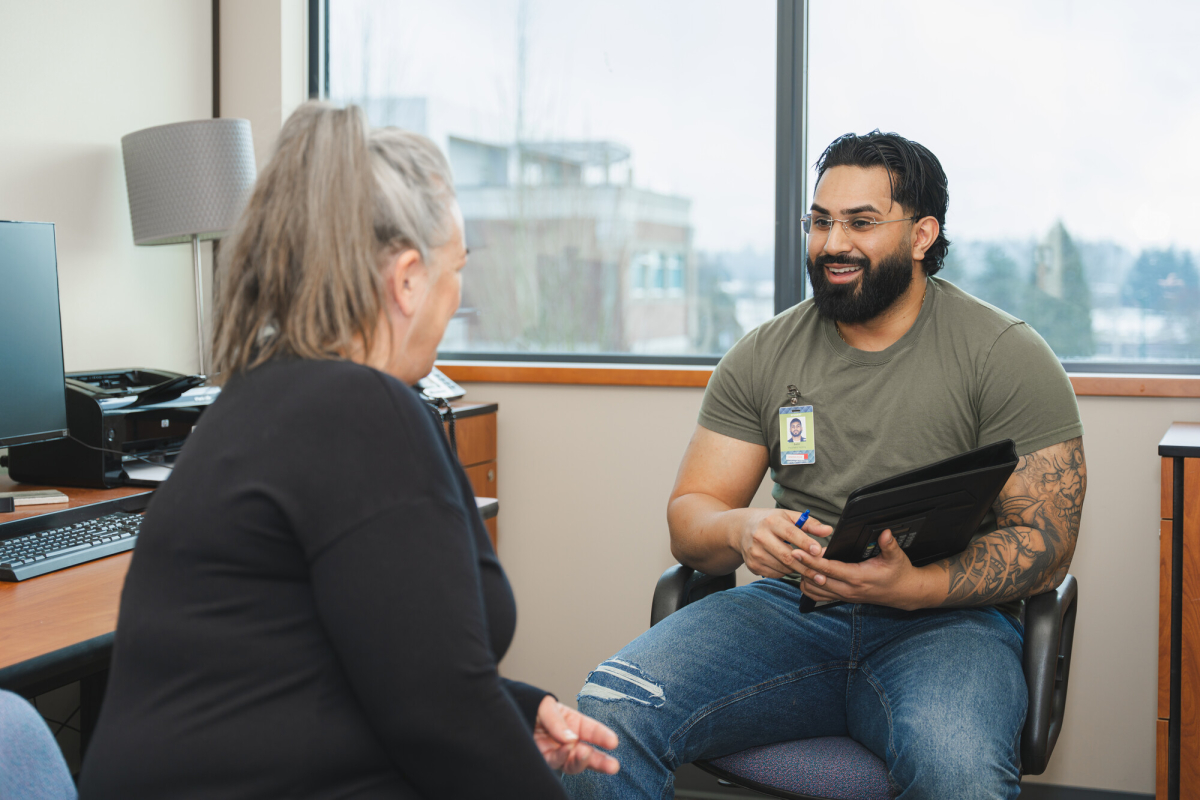 A mental health care provider meeting with a patient.